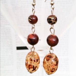 Brown bead dangle earrings with gold design